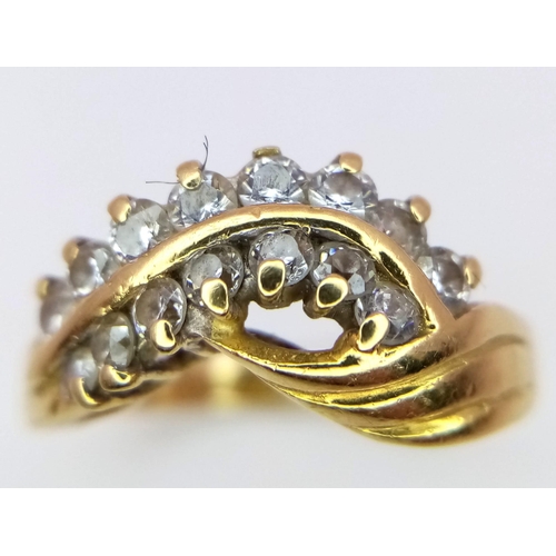 121 - An 18K Yellow Gold Two-Row Diamond Crossover Ring. Size M. 4.35g total weight. Ref: 016073