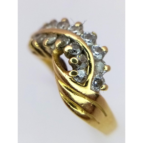 121 - An 18K Yellow Gold Two-Row Diamond Crossover Ring. Size M. 4.35g total weight. Ref: 016073