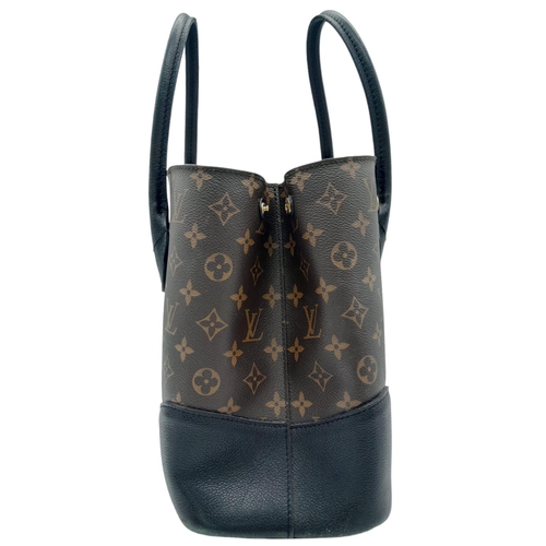 127 - A Louis Vuitton Monogram Flandrin Handbag. Leather exterior with gold-toned hardware, two rolled lea... 