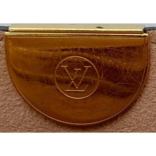 127 - A Louis Vuitton Monogram Flandrin Handbag. Leather exterior with gold-toned hardware, two rolled lea... 