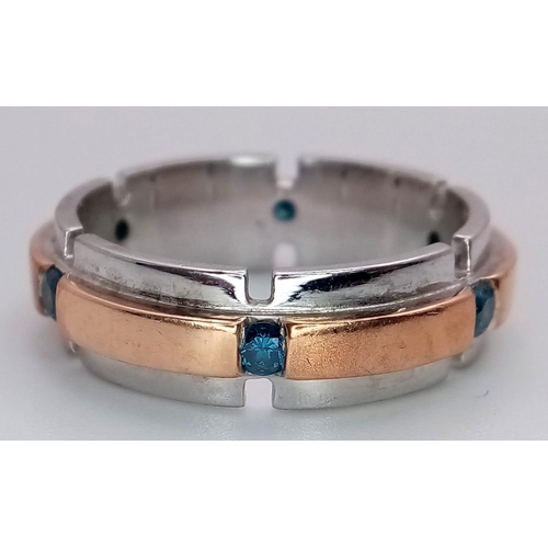 130 - An 18K White and Rose Gold Gents Band Ring - With an eternal setting of six blue topaz stones. Size ... 