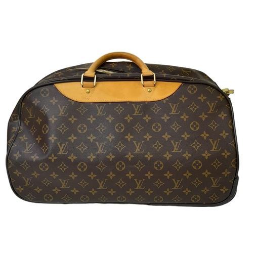 134 - A Louis Vuitton Monogram Eole Convertible Travel Bag. Leather exterior with gold-toned hardware, lug... 