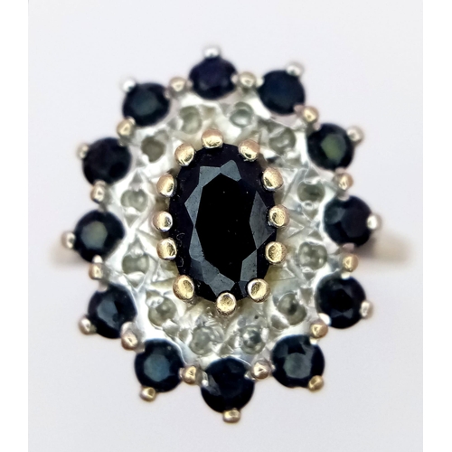 138 - A 9K YELLOW GOLD DIAMOND & SAPPHIRE CLUSTER RING. TOTAL WEIGHT 2.8G. SIZE L