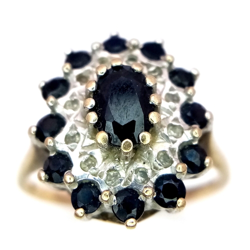 138 - A 9K YELLOW GOLD DIAMOND & SAPPHIRE CLUSTER RING. TOTAL WEIGHT 2.8G. SIZE L