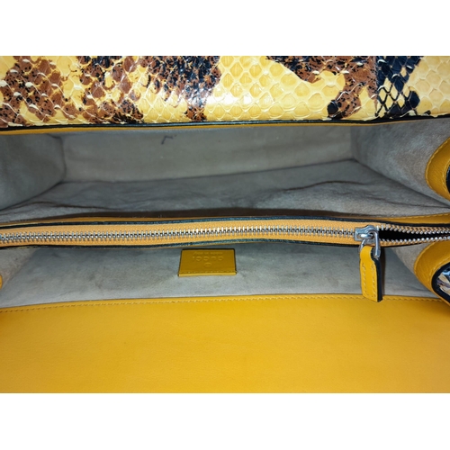 141 - A Gucci Dionysus Python Pochette. With Silver Metal Hardware and Convertible Silver Metal Chain Stra... 