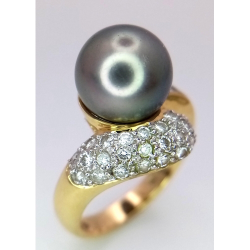 144 - An 18K Yellow Gold Tahitian Pearl and Diamond Ring. Central pearl with baguette and pave diamond cro... 