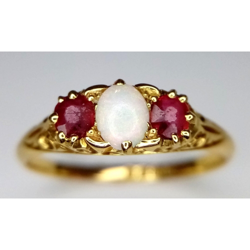 152 - A VINTAGE 18K YELLOW GOLD OPAL & RED STONE RING. TOTAL WEIGHT 3.1G. SIZE S