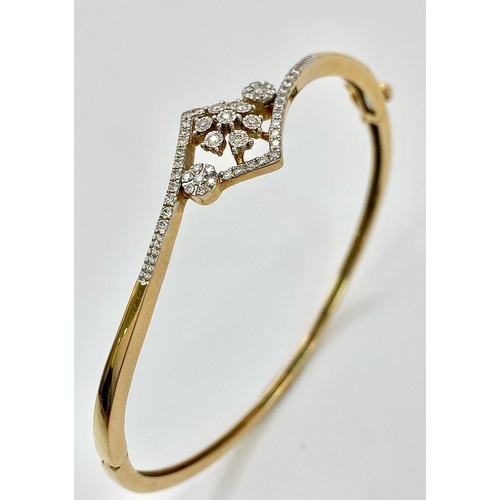 159 - A 18K YELLOW GOLD 0.32CT  DIAMOND SET BANGLE. TOTAL WEIGHT 11G