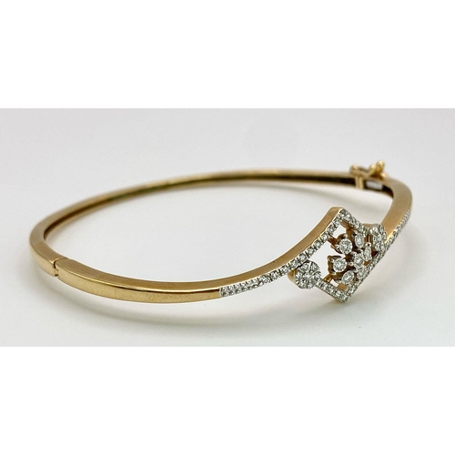 159 - A 18K YELLOW GOLD 0.32CT  DIAMOND SET BANGLE. TOTAL WEIGHT 11G