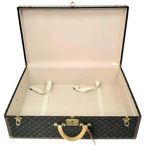 17 - A Louis Vuitton Alzer 80 Monogram Large Sturdy Suitcase/Trunk. Monogram canvas and brown leather ext... 