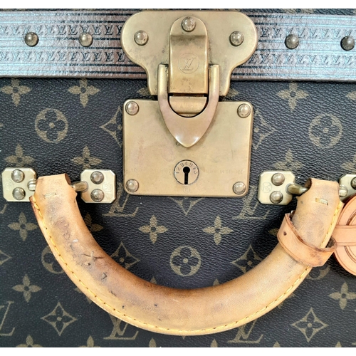 17 - A Louis Vuitton Alzer 80 Monogram Large Sturdy Suitcase/Trunk. Monogram canvas and brown leather ext... 