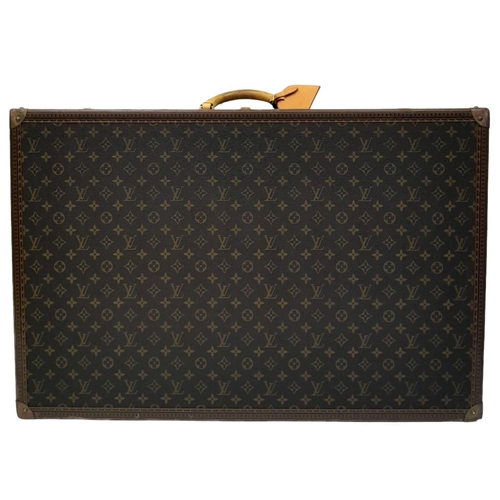 17 - A Louis Vuitton Alzer 80 Monogram Large Sturdy Suitcase/Trunk. Monogram canvas and brown leather ext... 