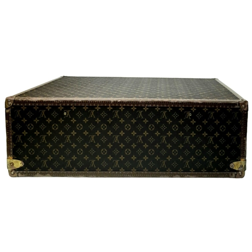 17 - A Louis Vuitton Alzer 80 Monogram Large Sturdy Suitcase/Trunk. Monogram canvas and brown leather ext... 