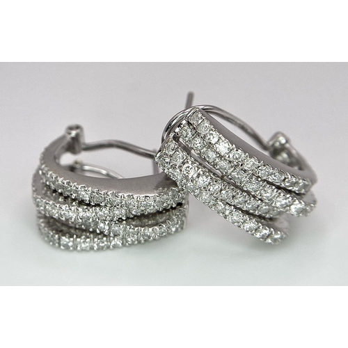 180 - A PAIR OF 18K WHITE GOLD DIAMOND EARRINGS. TOTAL WEIGHT 9.8G