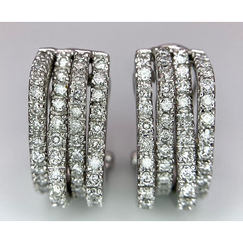 180 - A PAIR OF 18K WHITE GOLD DIAMOND EARRINGS. TOTAL WEIGHT 9.8G