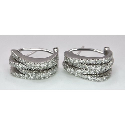 180 - A PAIR OF 18K WHITE GOLD DIAMOND EARRINGS. TOTAL WEIGHT 9.8G