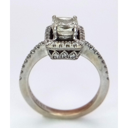 186 - A 14K White Gold Princess Cut Diamond Ring. A beautiful (slightly tinted) 1.13ct central princess cu... 