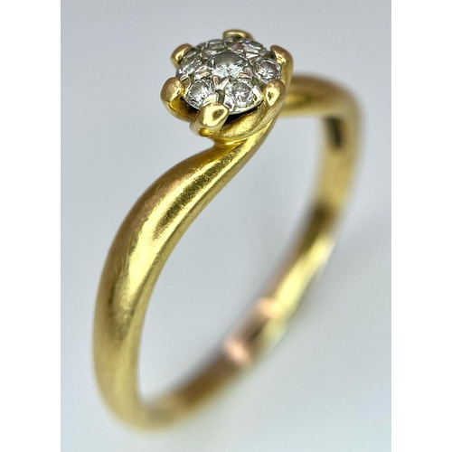 207 - A 18K YELLOW GOLD 0.10CT  DIAMOND TWIST RING. TOTAL WEIGHT 2.6G. SIZE O