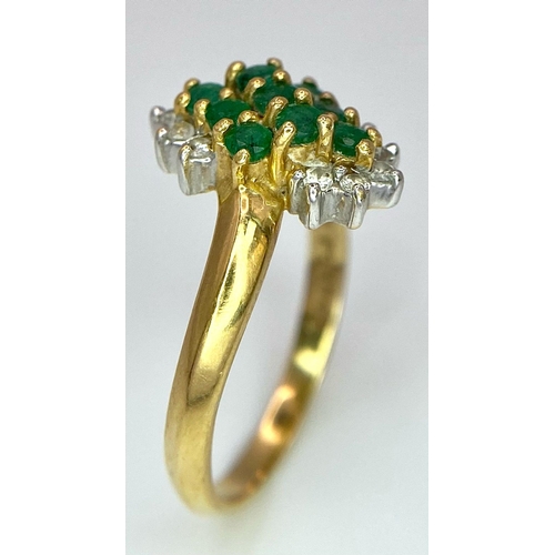 214 - A 18K YELLOW GOLD DIAMOND & EMERALD CLUSTER RING. TOTAL WEIGHT 3.2G. SIZE M