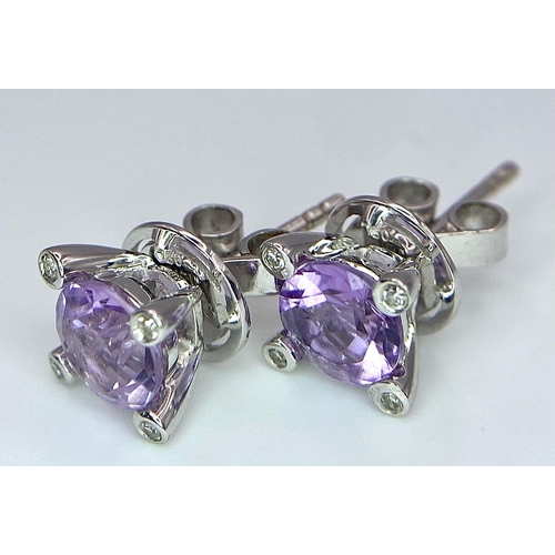 221 - A PAIR OF 18K WHITE GOLD DIAMOND & AMETHYST STUD EARRINGS. TTOAL WEIGHT 2.9G