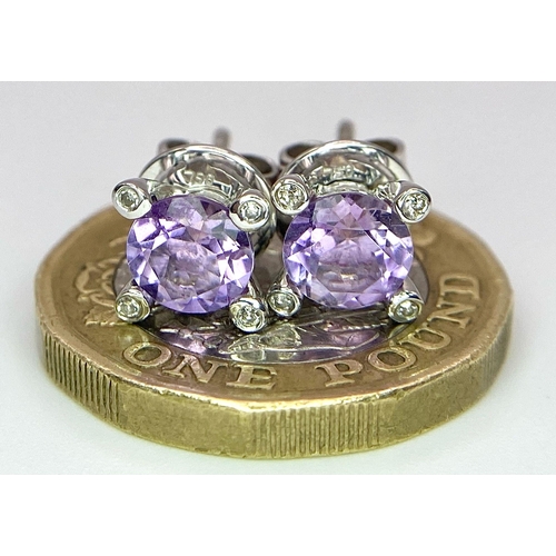 221 - A PAIR OF 18K WHITE GOLD DIAMOND & AMETHYST STUD EARRINGS. TTOAL WEIGHT 2.9G