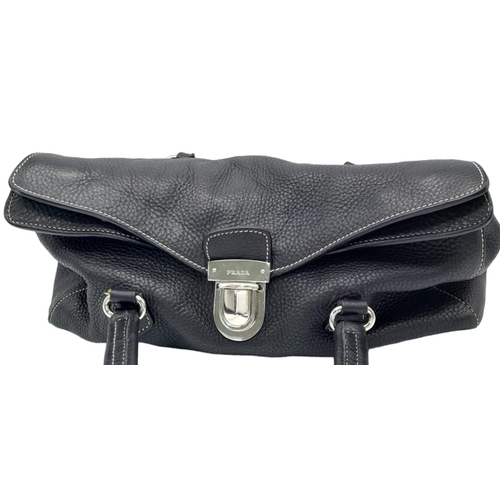 241 - A Prada Black Vitello Shoulder Bag. Leather exterior with silver-toned hardware, two straps, push lo... 