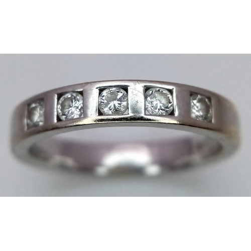 260 - An 18K White Gold Diamond Half-Eternity Ring. 0.25ctw of diamonds. Size L/M. 3.95g total weight. Ref... 