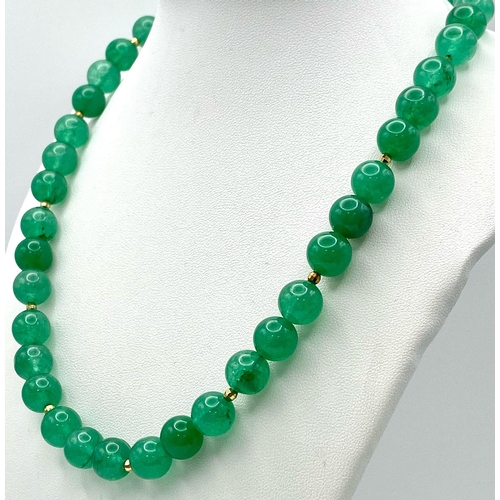 291 - A Jade Bead Necklace with 9K Gold Clasp. 42cm length.