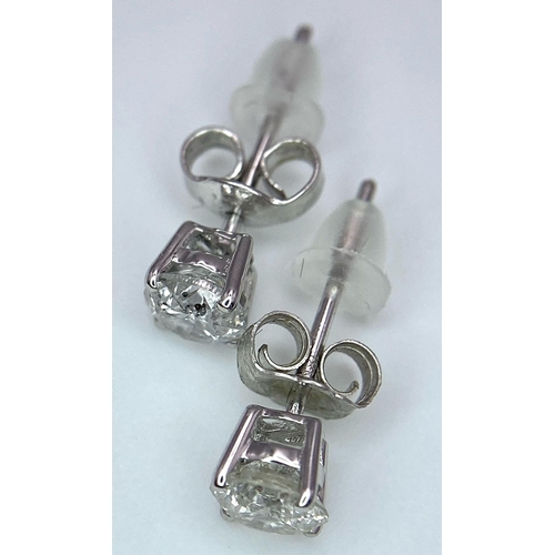 318 - A Pair of 18K Diamond Stud Earrings. Two brilliant round cut diamonds. 0.75ctw. 1.07g total weight. ... 