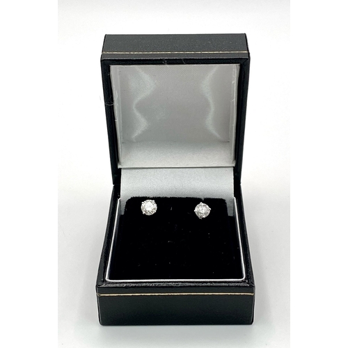 318 - A Pair of 18K Diamond Stud Earrings. Two brilliant round cut diamonds. 0.75ctw. 1.07g total weight. ... 