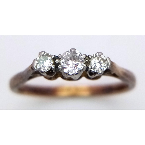 319 - A 18K YELLOW GOLD & PLATINUM 3 STONE 0.25CT DIAMOND RING. TOTAL WEIGHT 2.3G. SIZE N