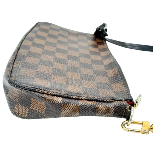 361 - A Louis Vuitton Damier Ebene Pochette with Leather Exterior. Top Zip Closure. Red Fabric Lining with... 