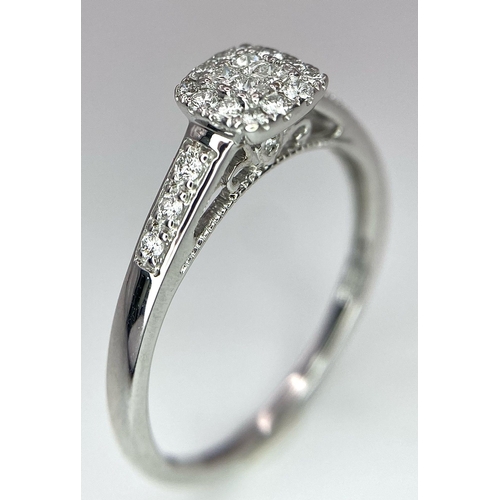 373 - A 9K WHITE GOLD 0.40CT DIAMOND CLUSTER RING. TOTAL WEIGHT 2.3G. SIZE U