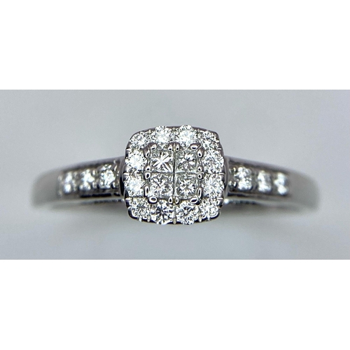 373 - A 9K WHITE GOLD 0.40CT DIAMOND CLUSTER RING. TOTAL WEIGHT 2.3G. SIZE U