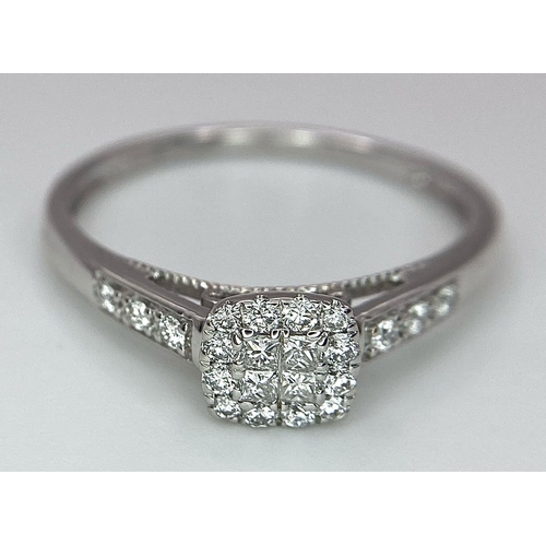 373 - A 9K WHITE GOLD 0.40CT DIAMOND CLUSTER RING. TOTAL WEIGHT 2.3G. SIZE U