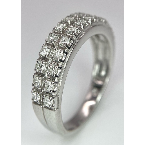 380 - A 9K WHITE GOLD 2 ROW 0.25CT DIAMOND BAND RING. TOTAL WEIGHT 3.4G. SIZE O