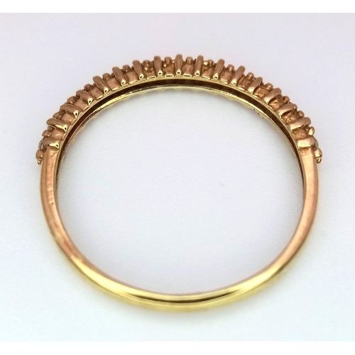 393 - An 18K Yellow Gold Diamond Half Eternity Ring. Size N. 1.32g total weight.