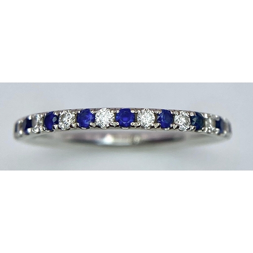 429 - A 14ct white gold diamond and sapphire full eternity ring set with 18 diamonds and 18 sapphires, 1.2... 