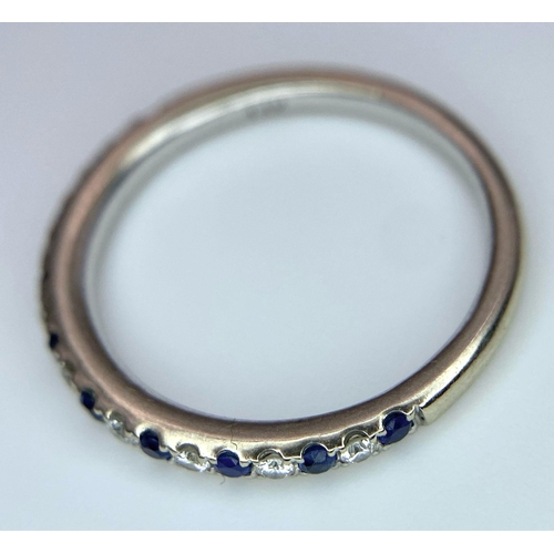 436 - A 14ct white gold diamond and sapphire half eternity ring, set with 9 diamonds and 10 sapphires, 1.7... 