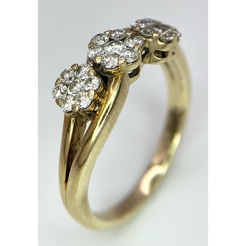 583 - A 9K YELLOW GOLD 0.50CT DIAMOND TRIPLE CLUSTER RING. TOTAL WEIGHT 3.4G. SIZE P