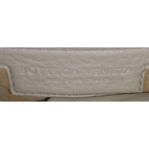 67 - A Bottega Veneta Cream Hobo Bag. Intracciato (woven) leather exterior with reptilian handles and bro... 