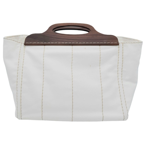 74 - A Prada White Exteriors with Brown Wooden Handle Logo-printed Striped Tote Bag. Vertical Stitching, ... 