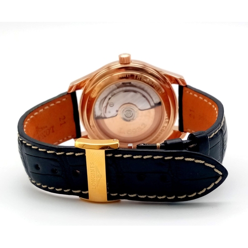 86 - A Glorious Longine 18K Rose Gold Automatic Gents Watch. Black Alligator leather strap. 18K rose gold... 