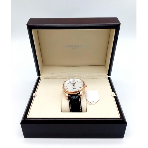 86 - A Glorious Longine 18K Rose Gold Automatic Gents Watch. Black Alligator leather strap. 18K rose gold... 