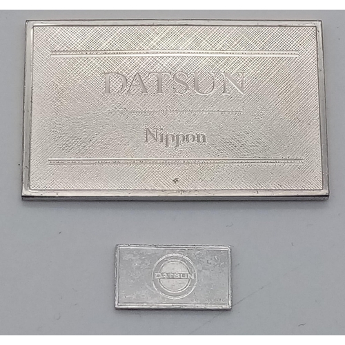 897 - A STERLING SILVER DATSUN NIPPON PLAQUE, PLUS MINI SILVER PLAQUE FOR THE CAR. 25g total weight.