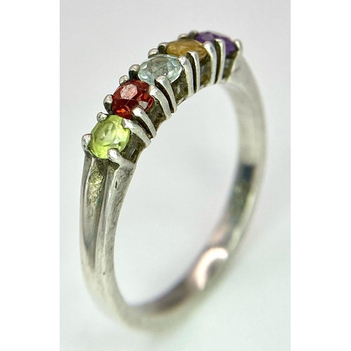 992 - A vintage 925 silver multi-colour gemstone ring. Total weight 2.45G. Size O.