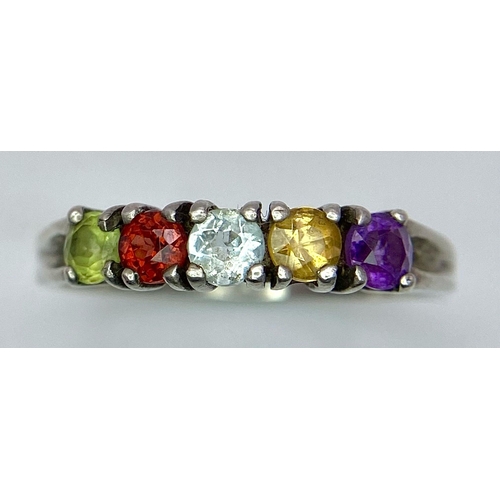 992 - A vintage 925 silver multi-colour gemstone ring. Total weight 2.45G. Size O.