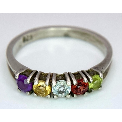 992 - A vintage 925 silver multi-colour gemstone ring. Total weight 2.45G. Size O.