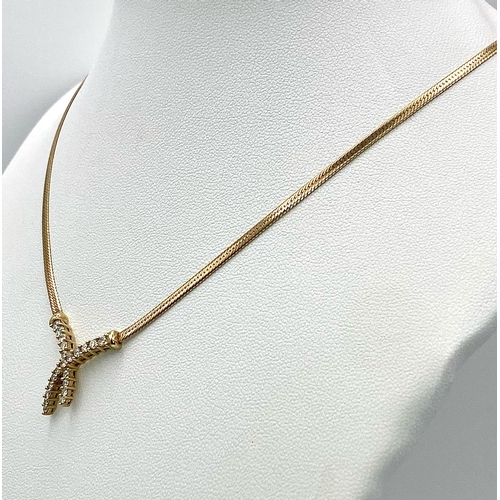 107 - A 9K Yellow Gold Herringbone Necklace with an Attached Eternal Crossover Diamond Pendant. 40cm neckl... 