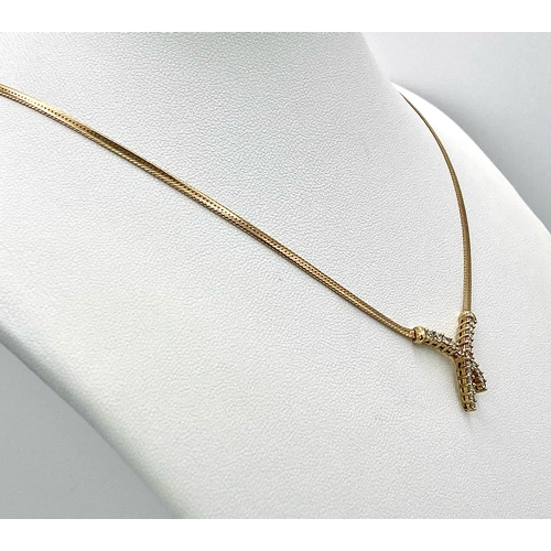 107 - A 9K Yellow Gold Herringbone Necklace with an Attached Eternal Crossover Diamond Pendant. 40cm neckl... 